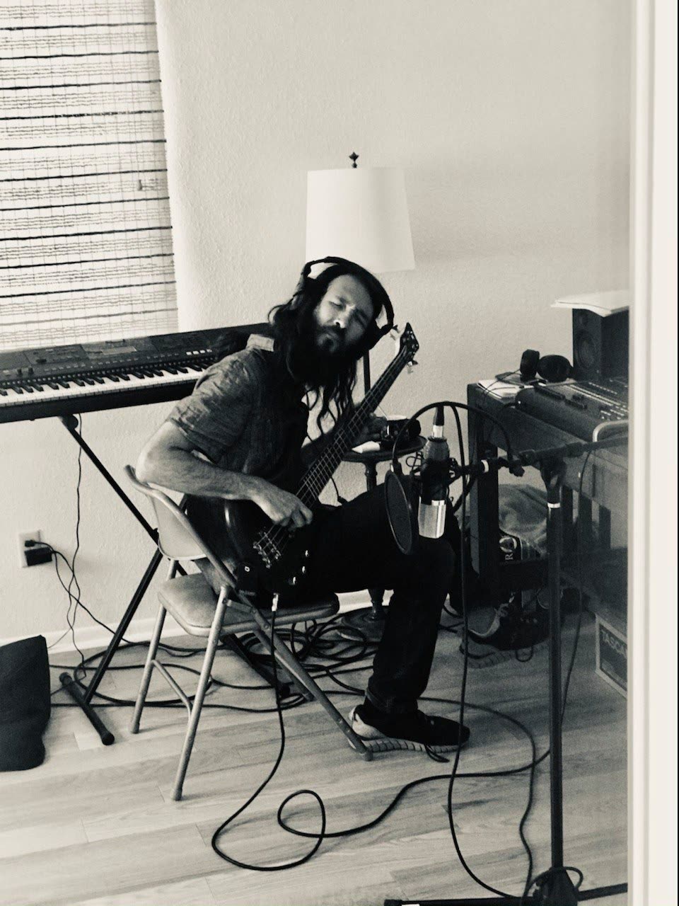 Michael playing bass in his home studio